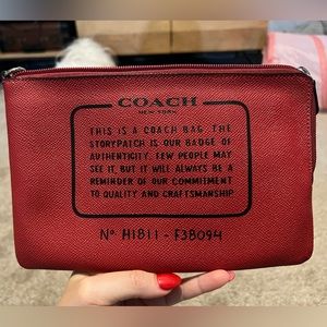 Small red leather travel bag.
